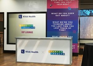 event branding on walls, windows and podium